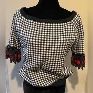 Black and white checkered off shoulder sweater